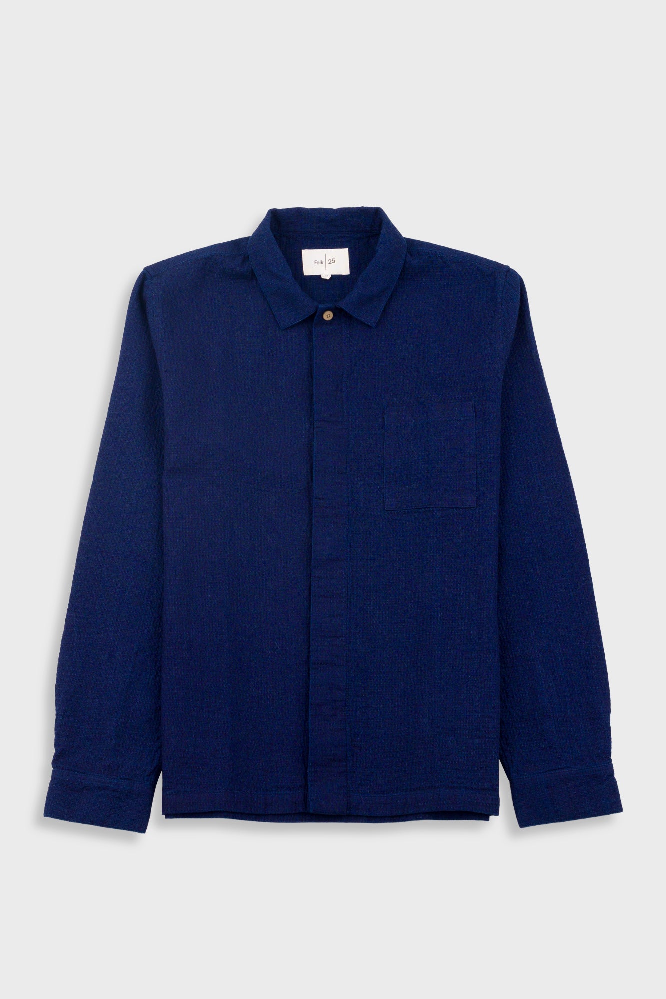 Navy blue shirt with a collar on a light gray background