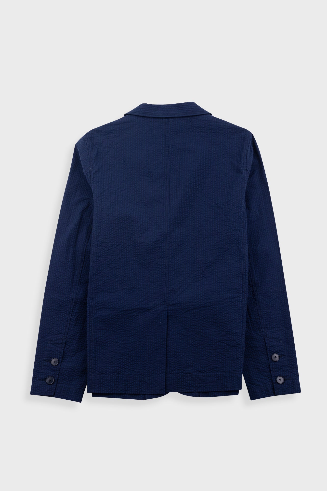 Navy blue jacket on a light gray background