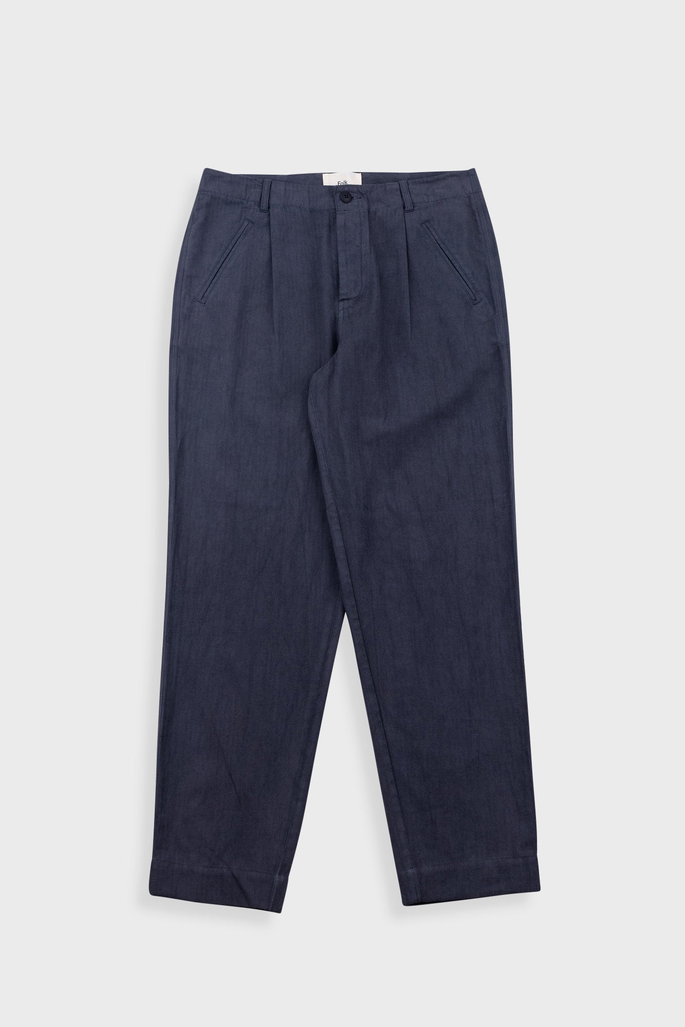 Navy blue pants on a light gray background