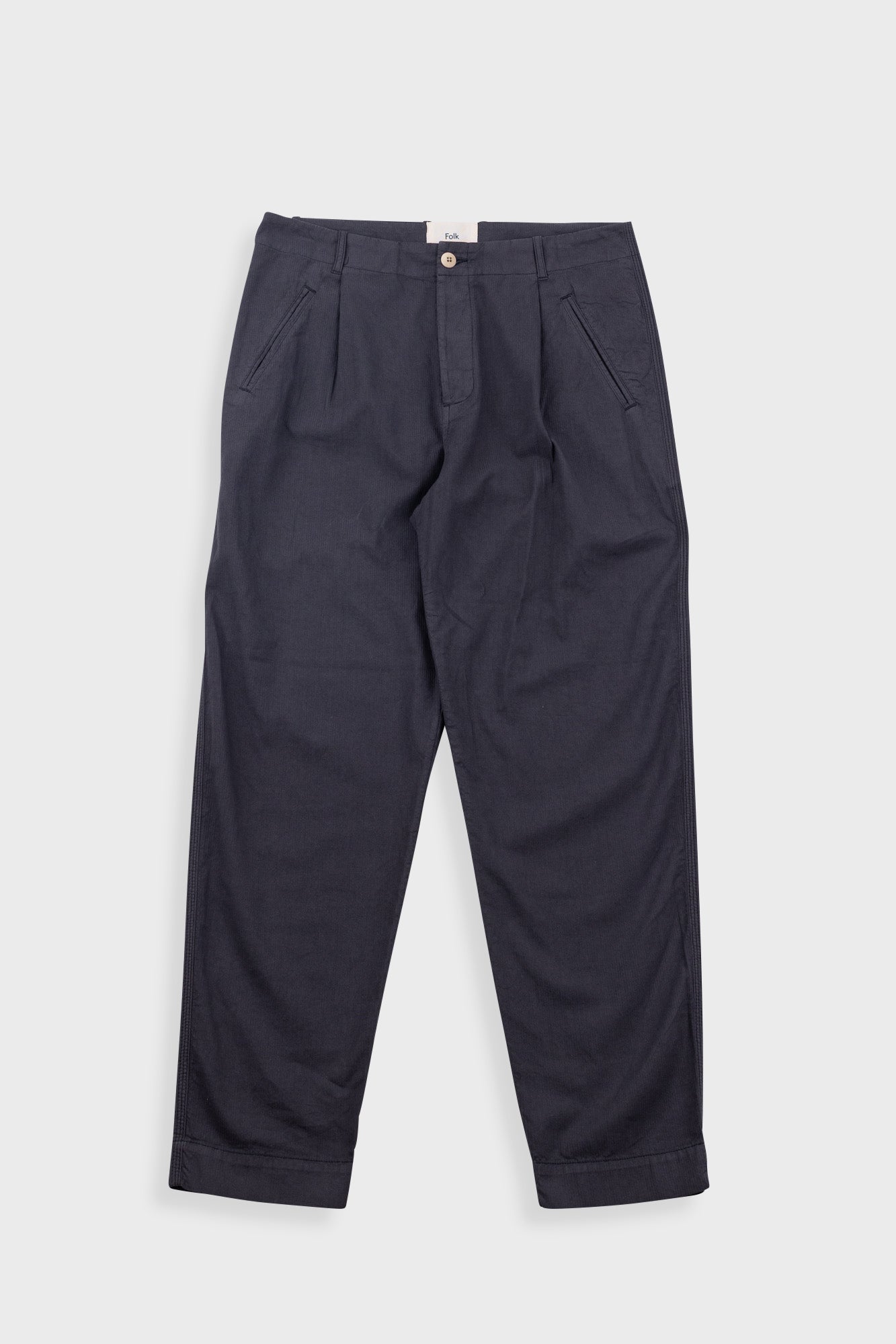 Dark blue pants on a light gray background