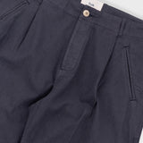 Navy pants with a visible brand label on a white background
