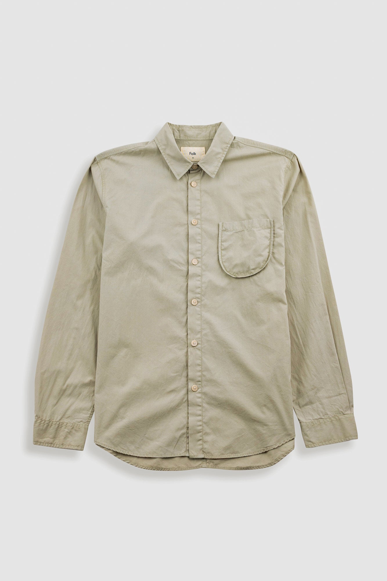 Light green shirt with a pocket on a white background