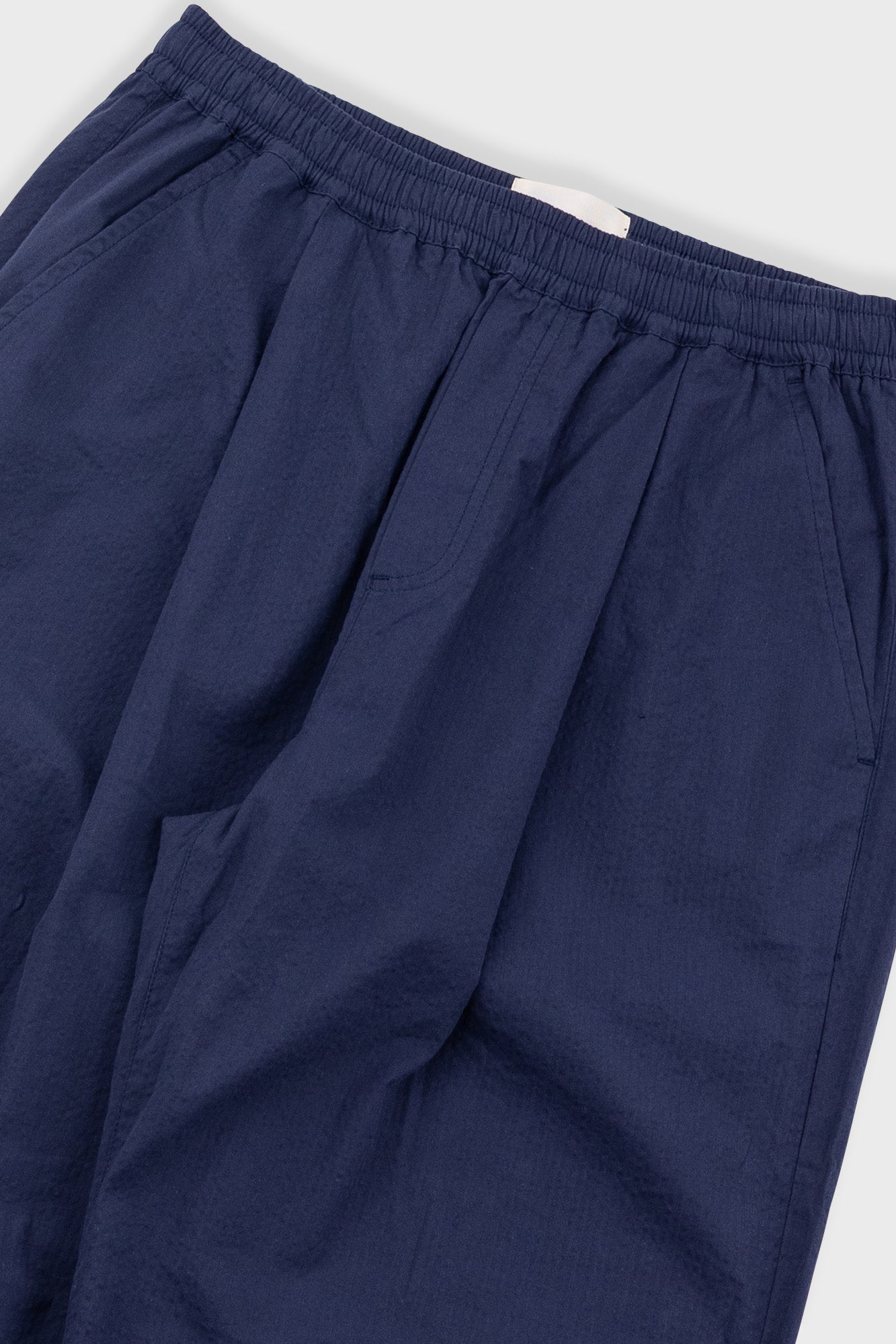 Navy blue pants on a white background