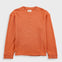 Orange long-sleeve shirt on a light gray background