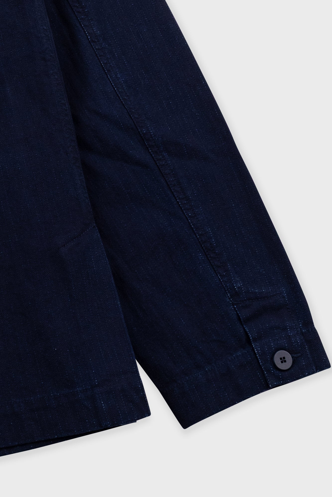 Navy blue pants with a button on a white background