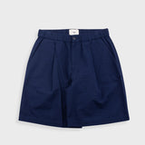Navy blue shorts on a light gray background