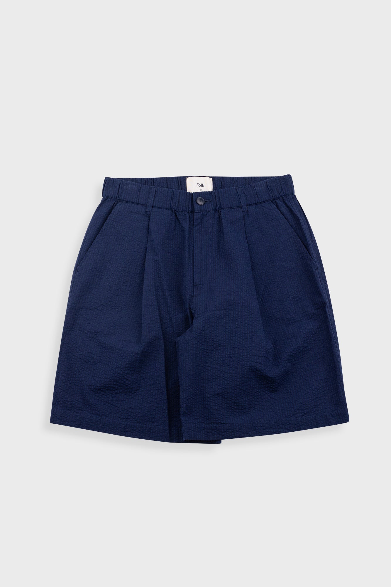 Navy blue shorts on a light gray background