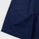 Close-up of a navy blue fabric on a white background