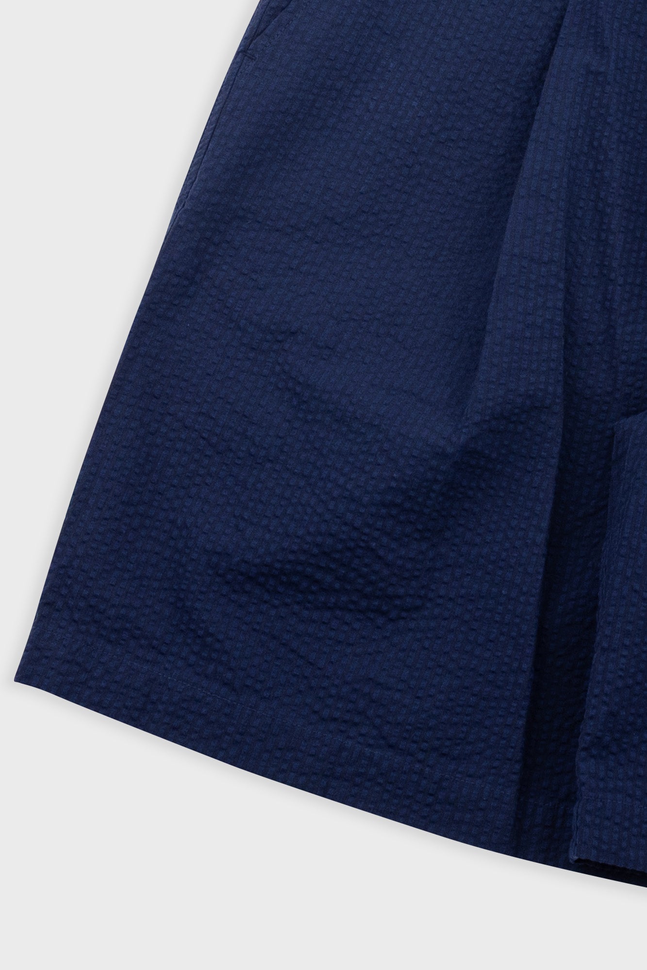 Close-up of a navy blue fabric on a white background