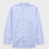 Light blue button-up shirt on a light gray background