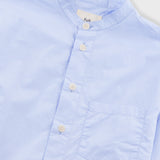 Blue shirt on light grey background