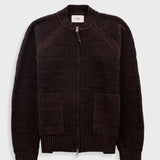 Dark brown textured sweater on a light gray background
