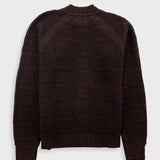 Dark brown textured sweater on a light gray background