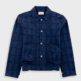 Navy blue checkered jacket on a light gray background
