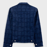 Blue denim jacket with a geometric pattern on a white background