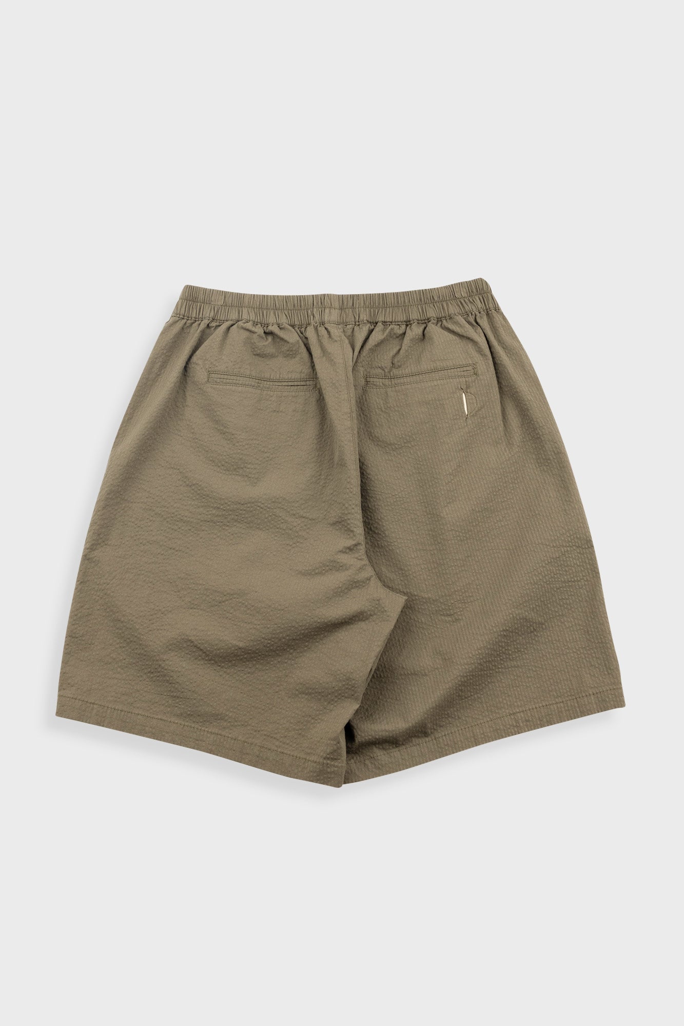 Olive green shorts with a drawstring on a white background