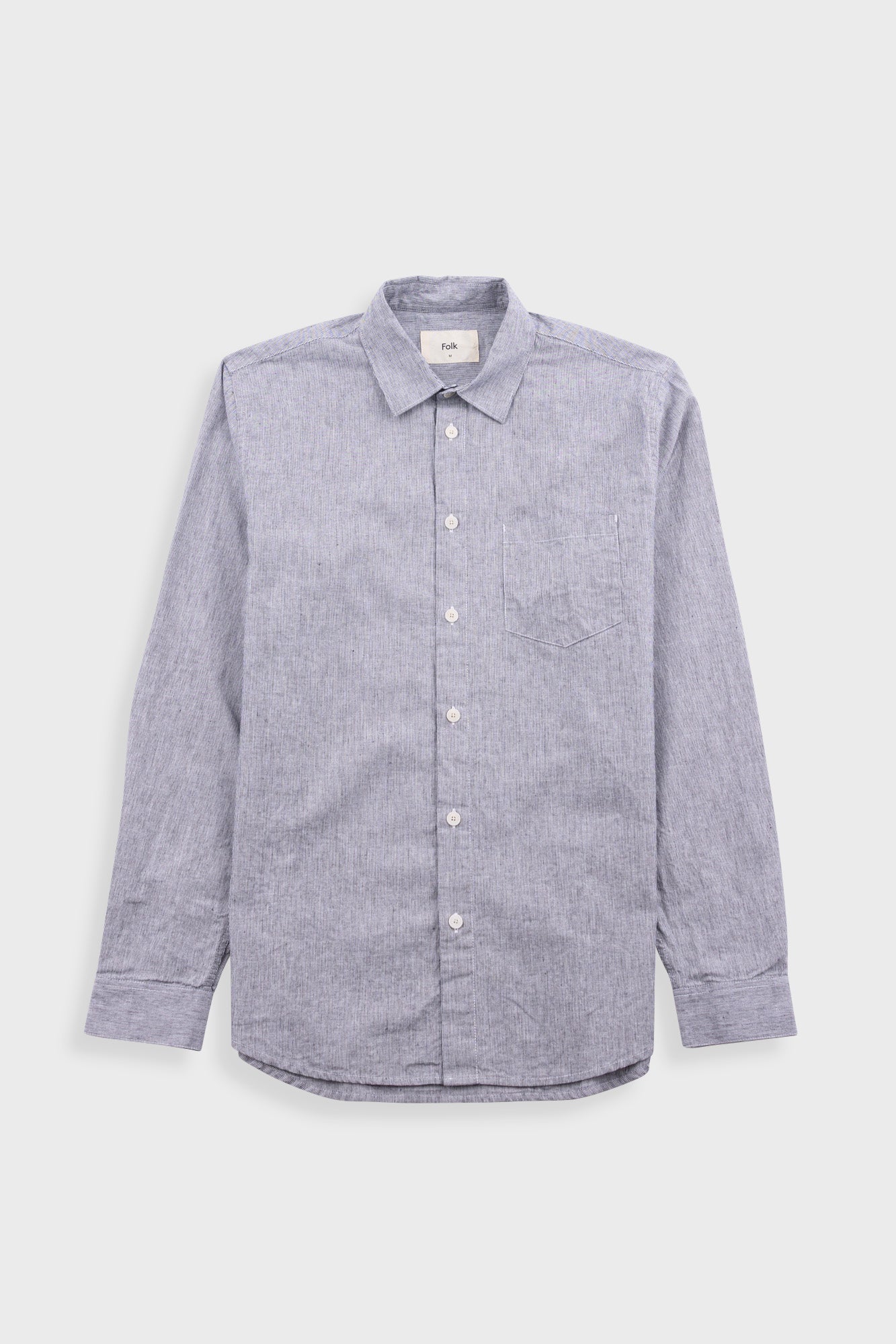 Black striped shirt on a light grey background