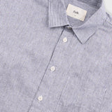 Gray button-up shirt with 'Folk' label on a light gray background