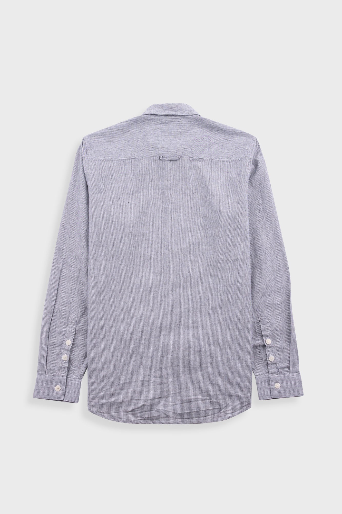 Grey striped shirt on a light gray background