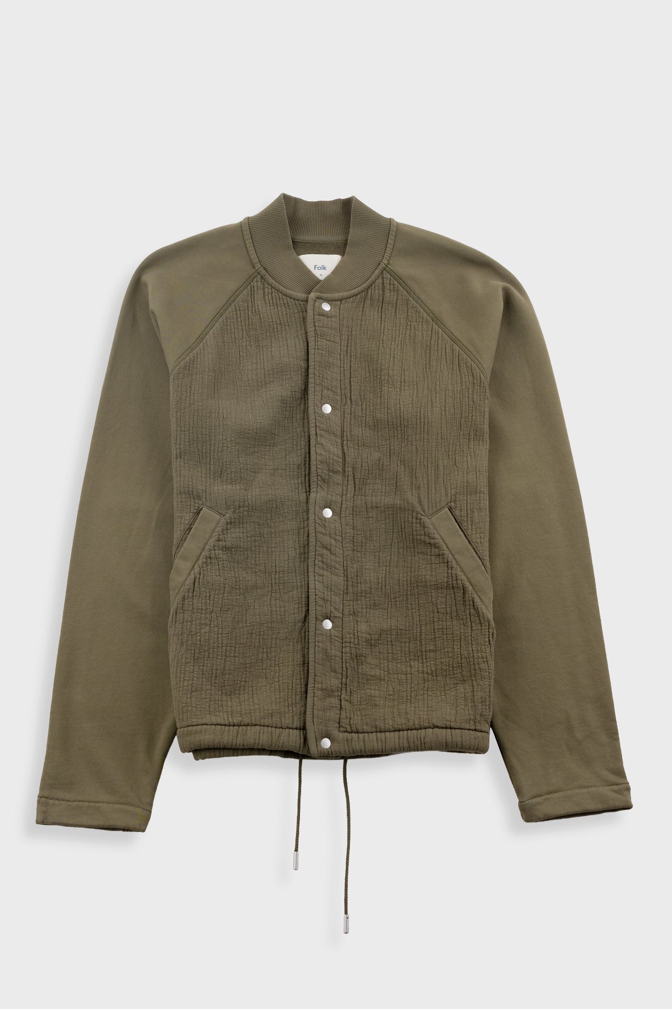 Green jacket with button details on a white background