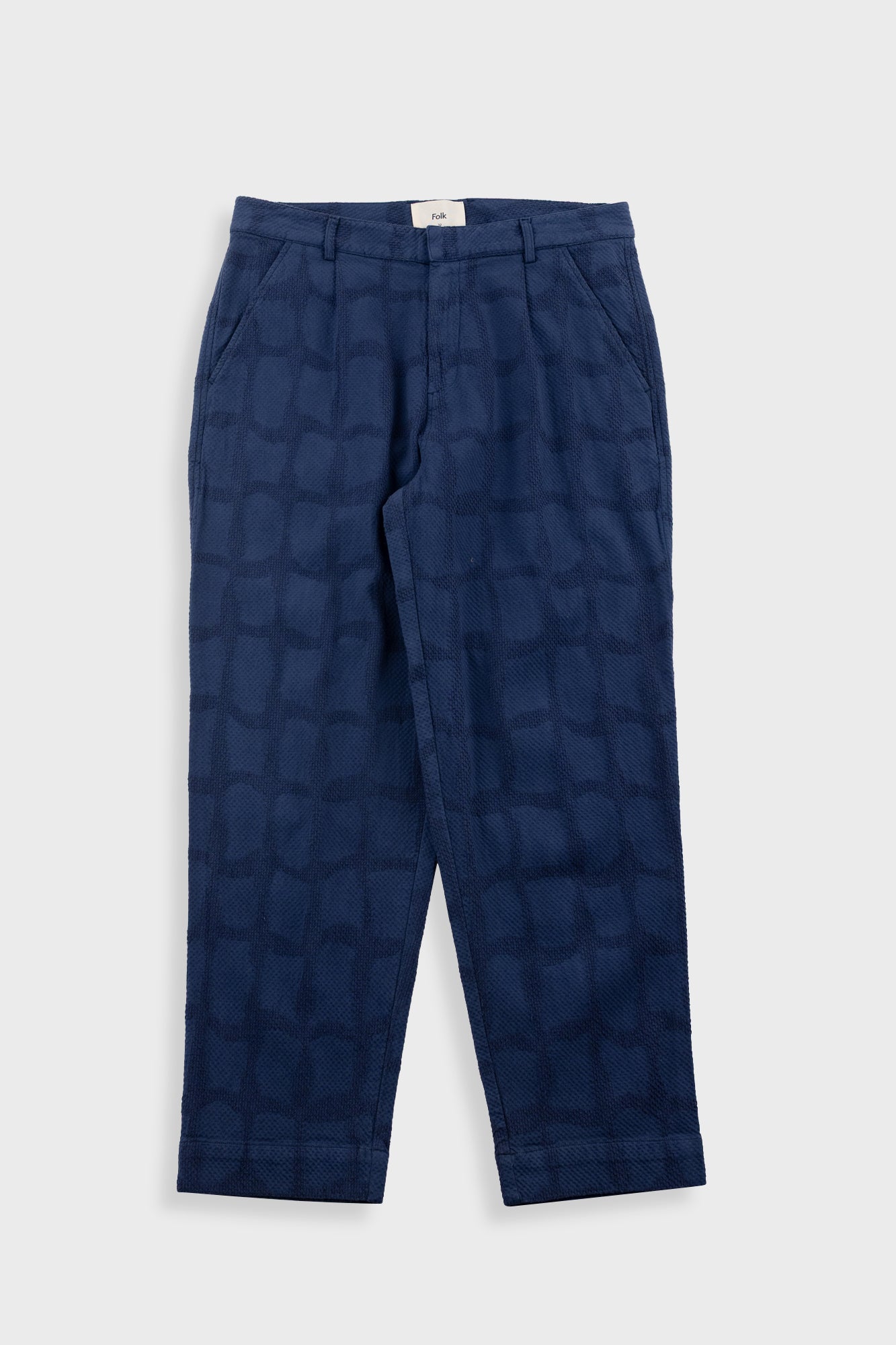 Blue patterned pants on a white background