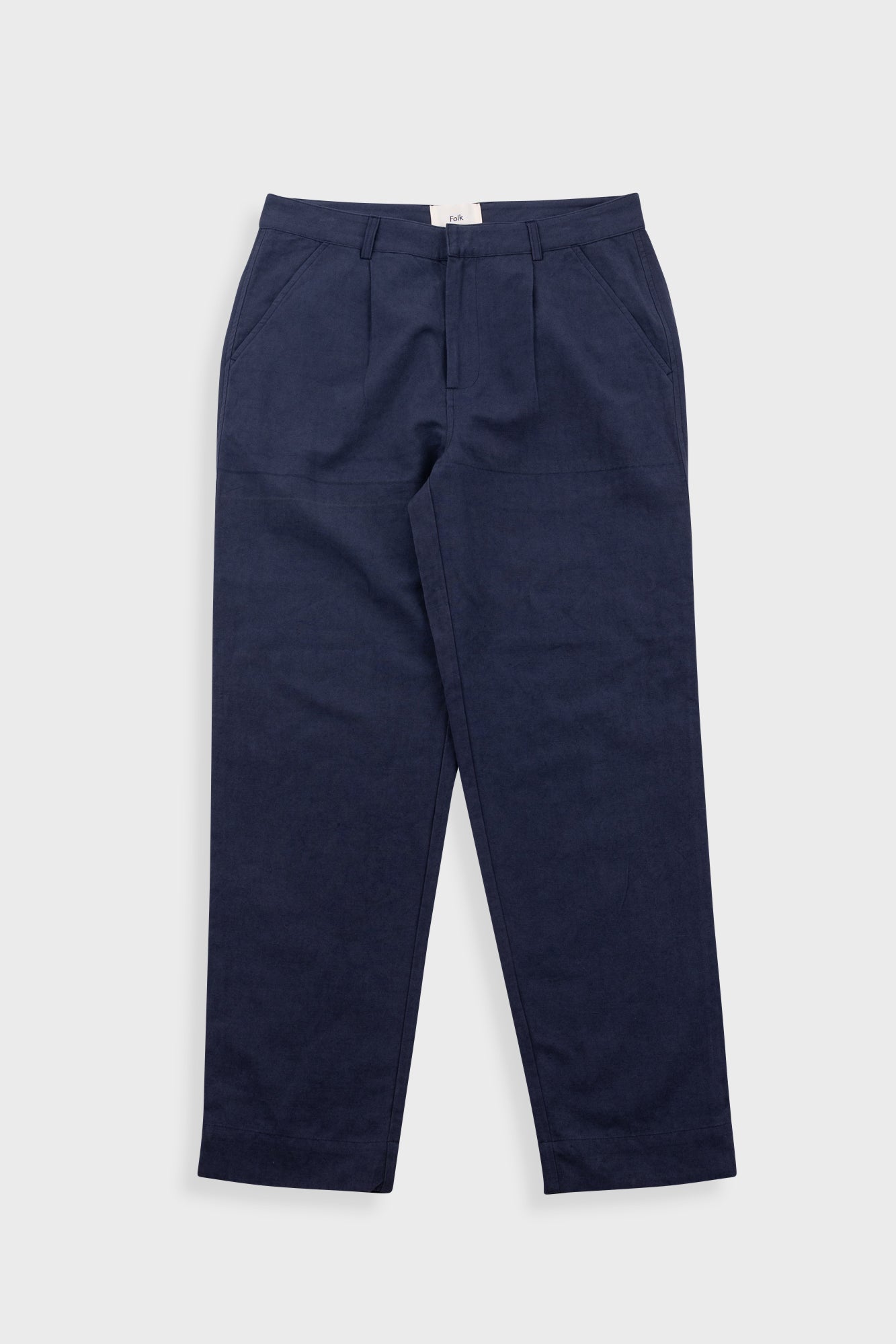 Navy blue pants on a light gray background