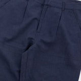 Navy blue pants with a visible brand label on a white background