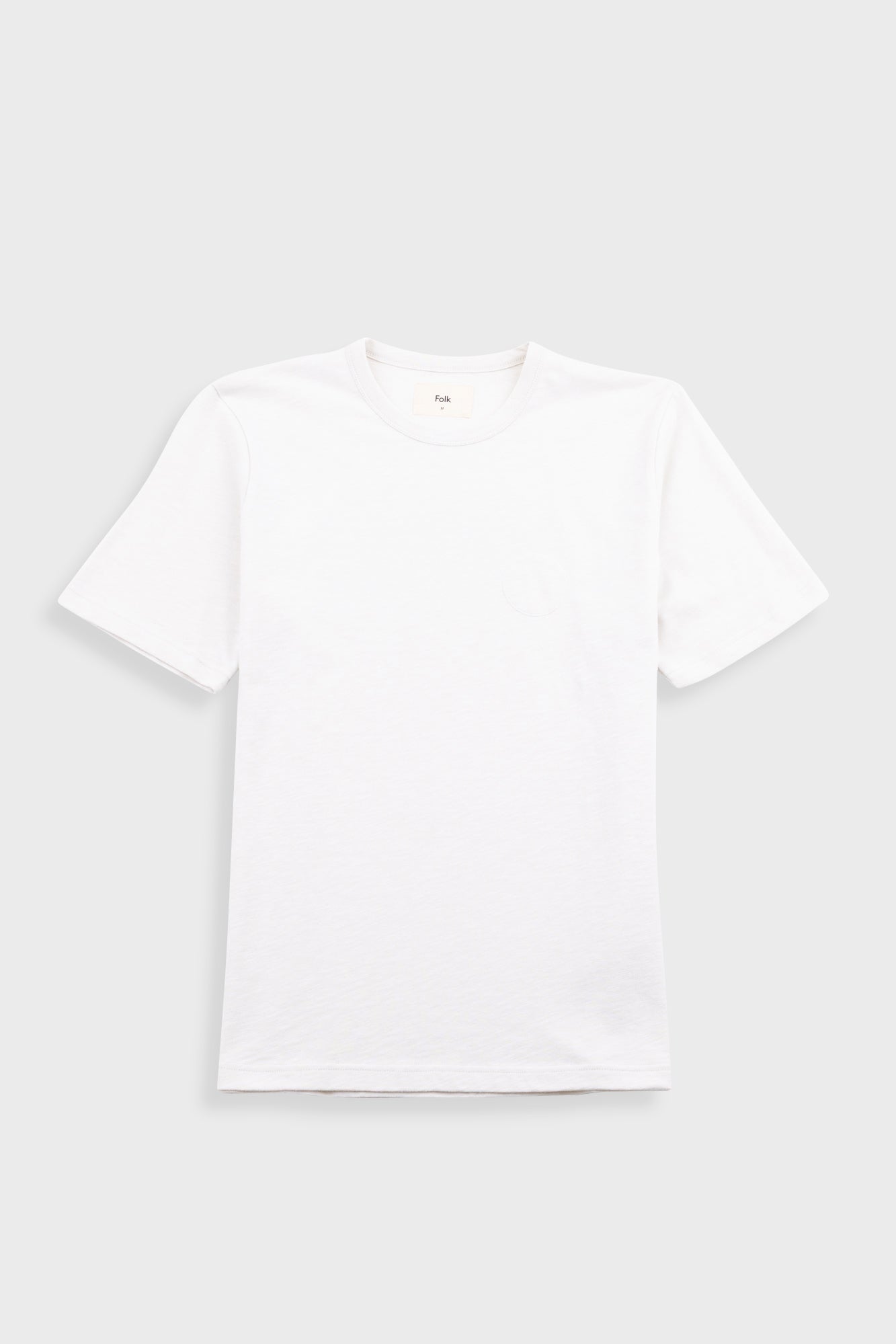 White t-shirt on a light gray background