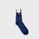 Navy and blue striped sock on grey background