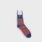 Orange and blue striped sock on grey background