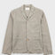 Sage blazer against a light grey background