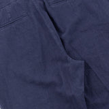 Close-up of blue pants on a white background