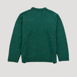 Green knitted sweater on a light gray background