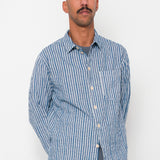 Man wearing a blue striped shirt against a white background