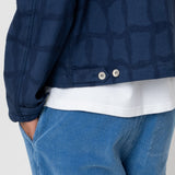 Man wearing a navy blue jacket against a white background
