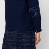 Navy blue patterned outfit on a plain background