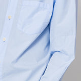 Close up of sleeve detail on light blue shirt