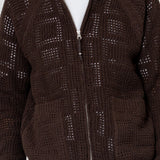 Brown knitted zip-up cardigan worn by a person on a white background