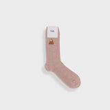 Beige sock with a label on a white background