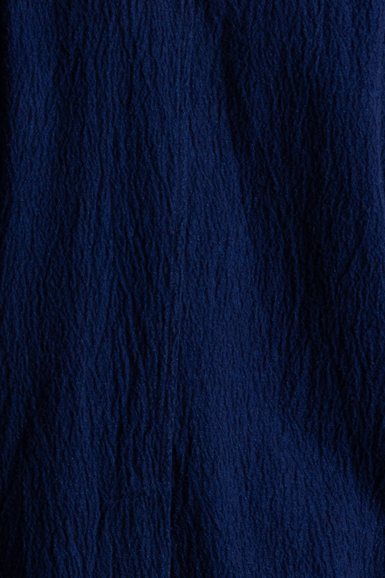 Close up of dark navy crepe fabric