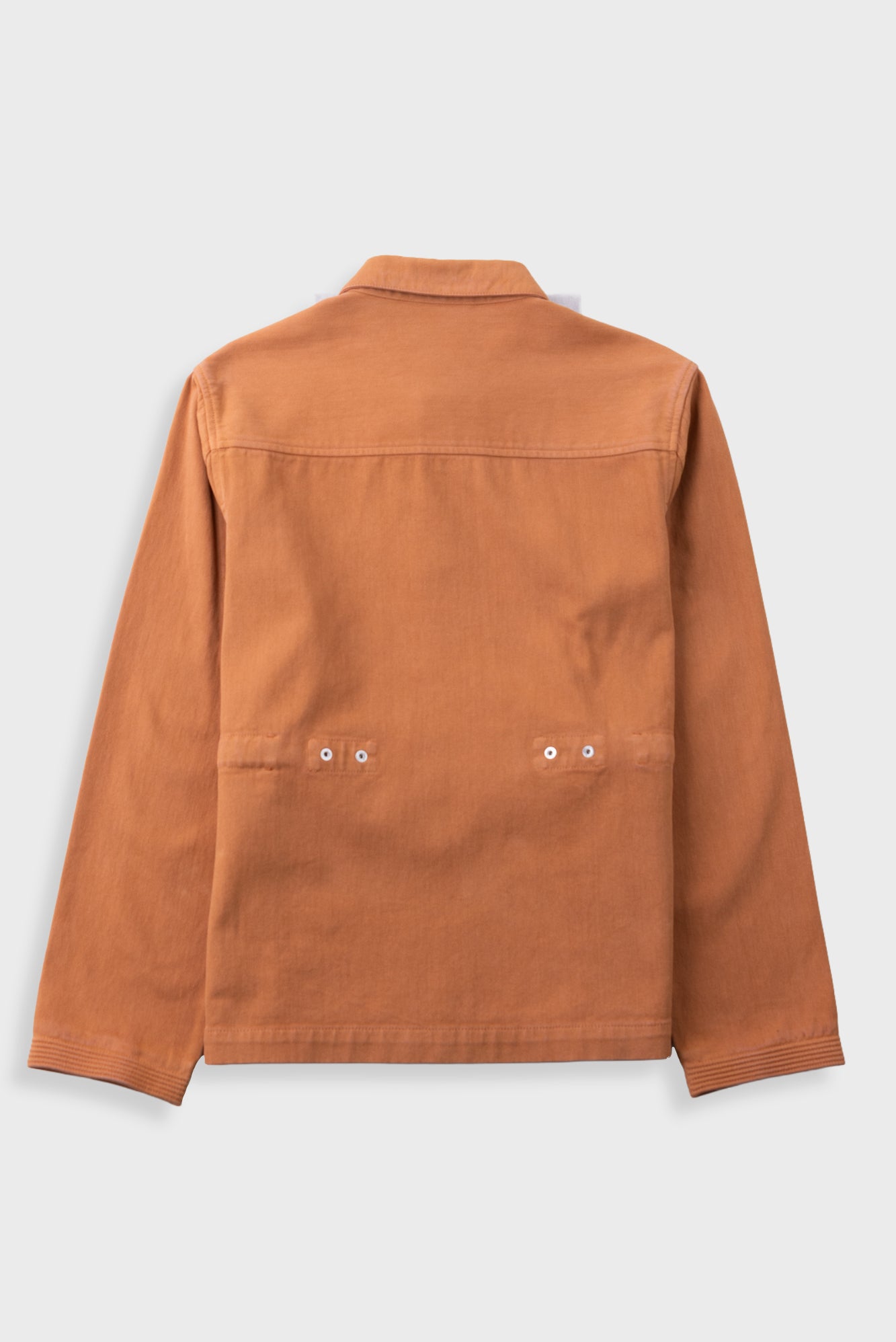 A long-sleeve utility jacket in a warm rust-orange color, shown from the back against a light gray background.
