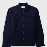 A dark navy blue corduroy utility jacket with brown buttons, a pointed collar, and a chest pocket, displayed flat against a light gray background.
