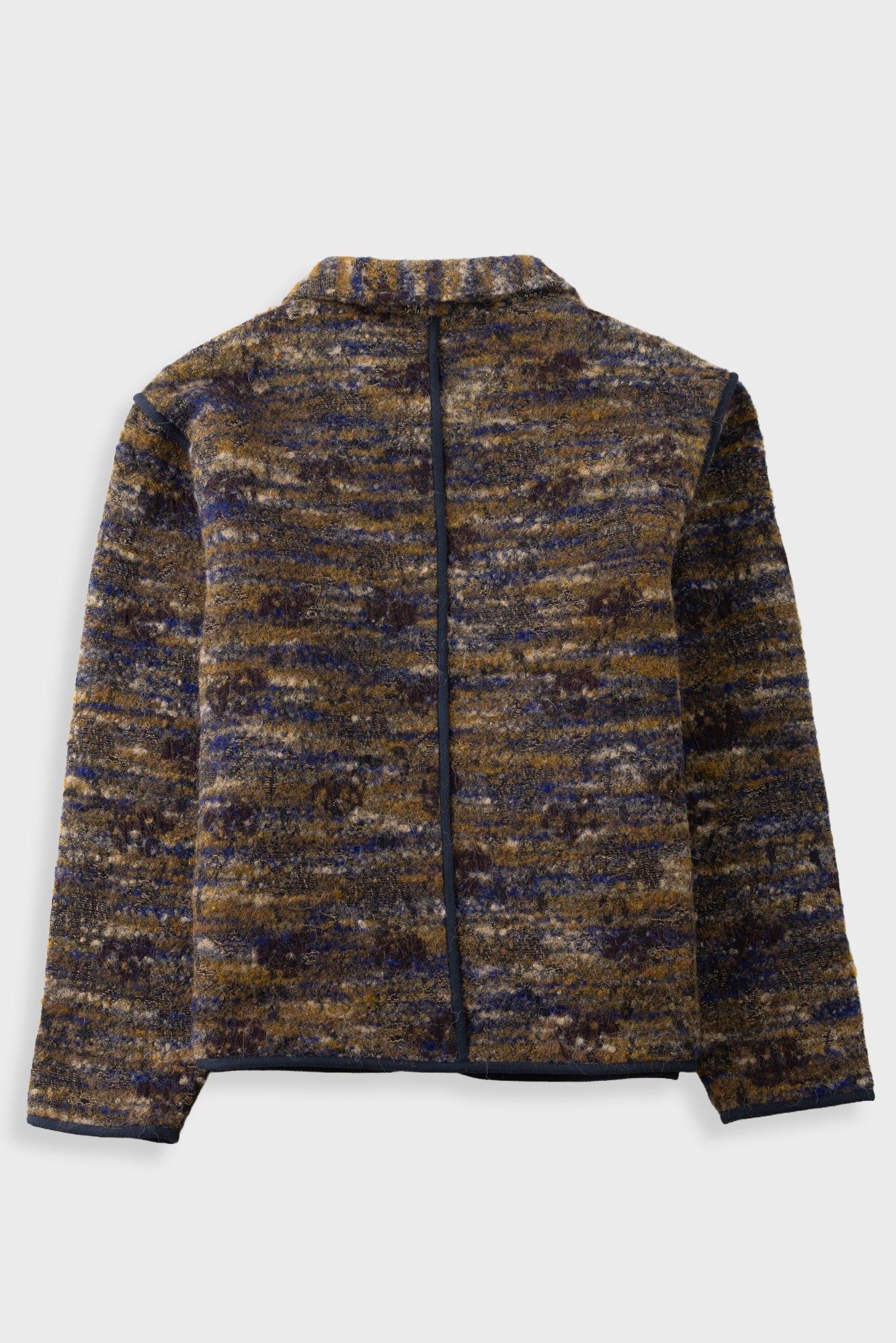 A zip-up jacket featuring a textured, marled tweed pattern in navy blue, brown, and gold. It has a stand-up collar, a front zipper, and two large front patch pockets with dark piping, shown against a light gray background.