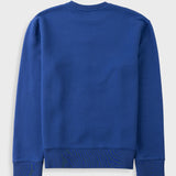 A royal blue long-sleeve crewneck sweatshirt shown from the back, laid flat against a light gray background.