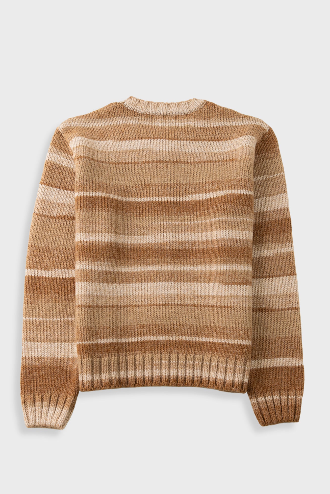 A long-sleeve crewneck knit sweater with horizontal stripes in shades of tan, brown, and cream, displayed flat against a light gray background.