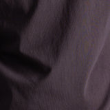 Close up of dark brown cotton fabric.