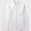 White cotton dress shirt with chest pocket laid flat against a grey background