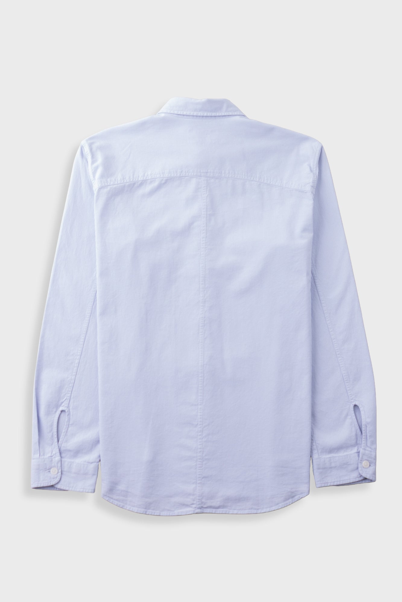 A light blue long-sleeve button-up shirt shown from the back, laid flat against a light gray background.
