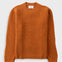 Orange knitted jumper against a light grey background