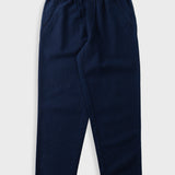 Navy trousers with an elasticated waistband, laid flat against a light grey background